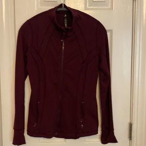 90 degrees zip up jacket.  Ladies size small,  burgundy color